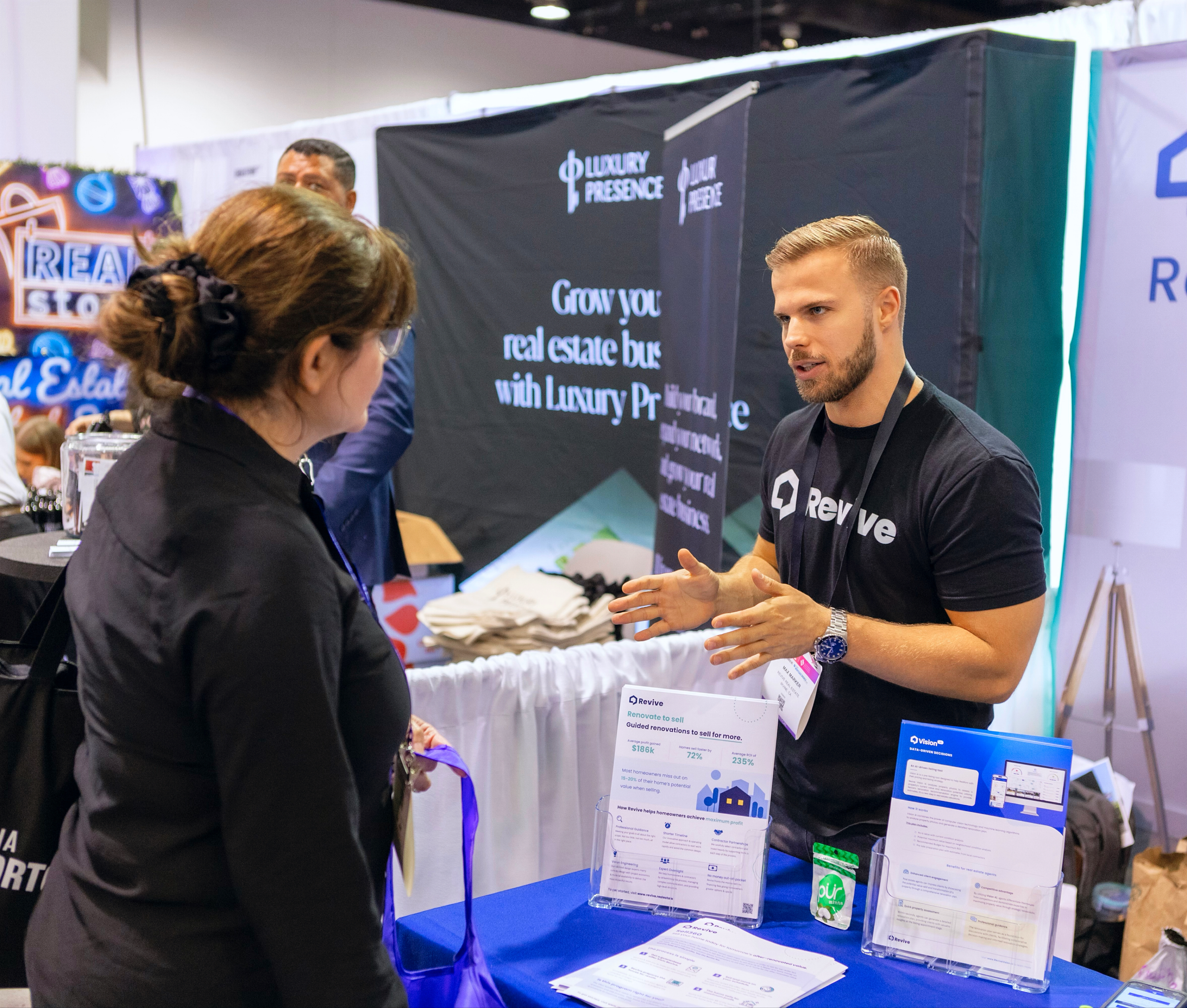 Max at a conference booth